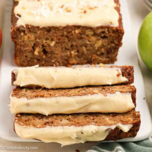 Sliced apple bread with a maple frosting.