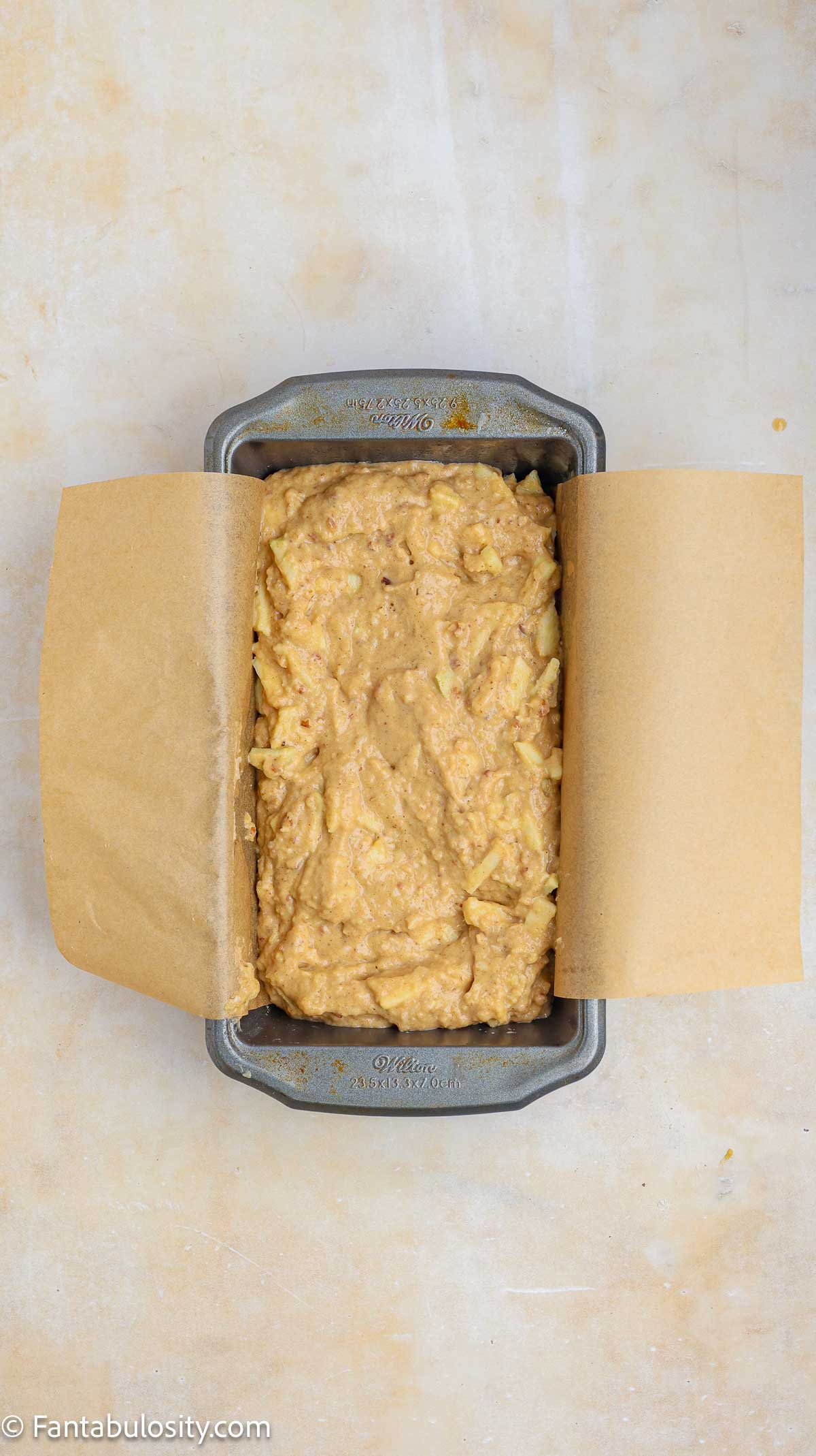 Apple bread batter in loaf pan.