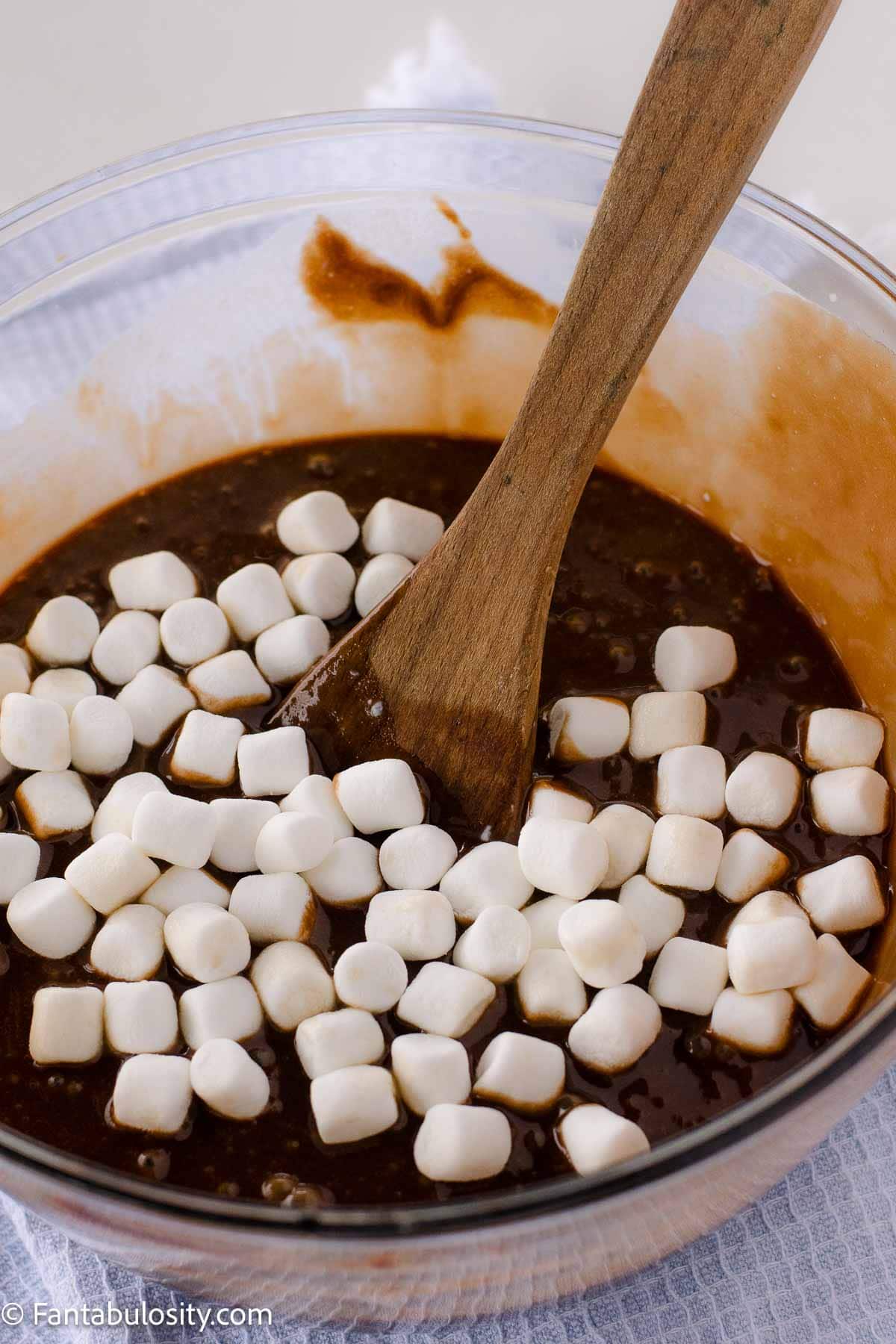 Marshmallows added to chocolate mixture in mixing bowl.