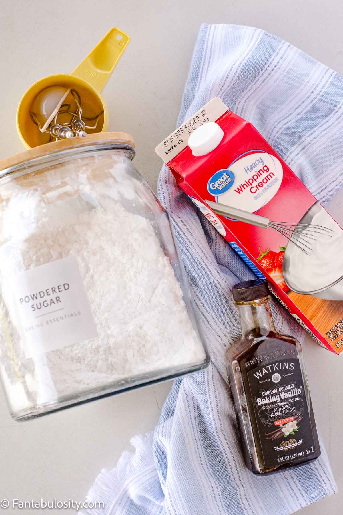 Ingredients to make homemade whipped cream sitting on counter.