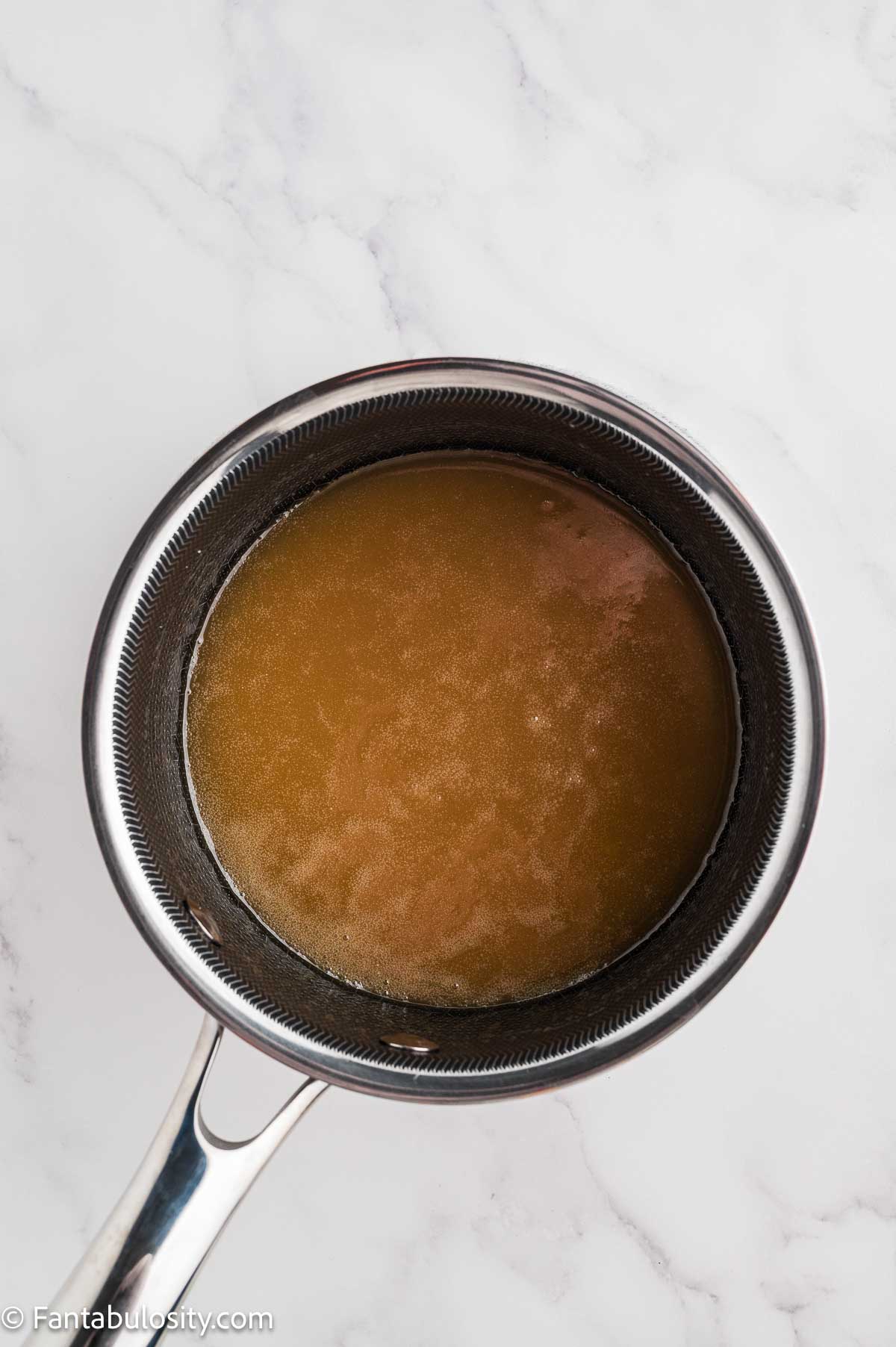 Caramel glaze after boiling in a small saucepan.