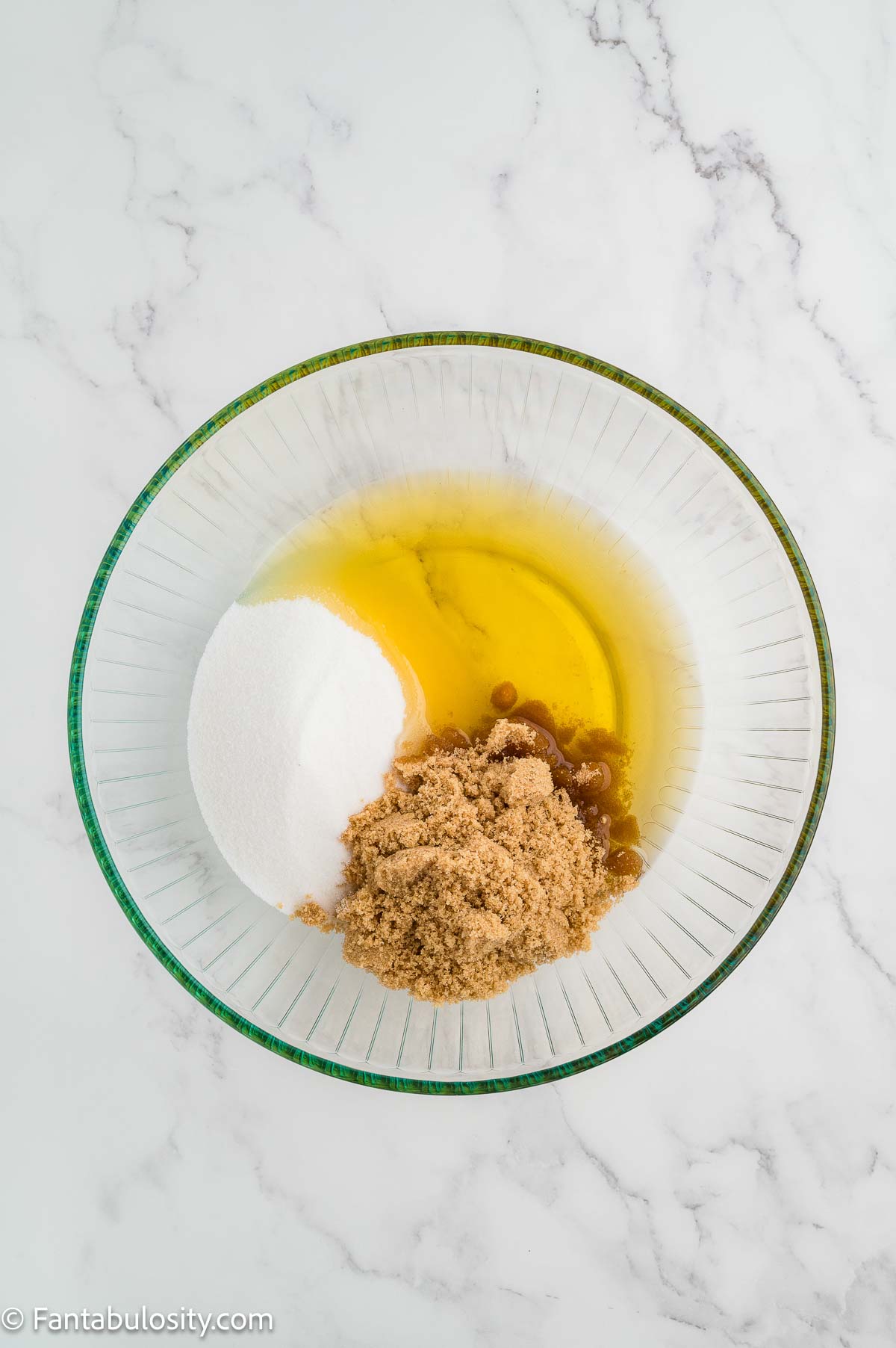 Sugars and oil in mixing bowl.
