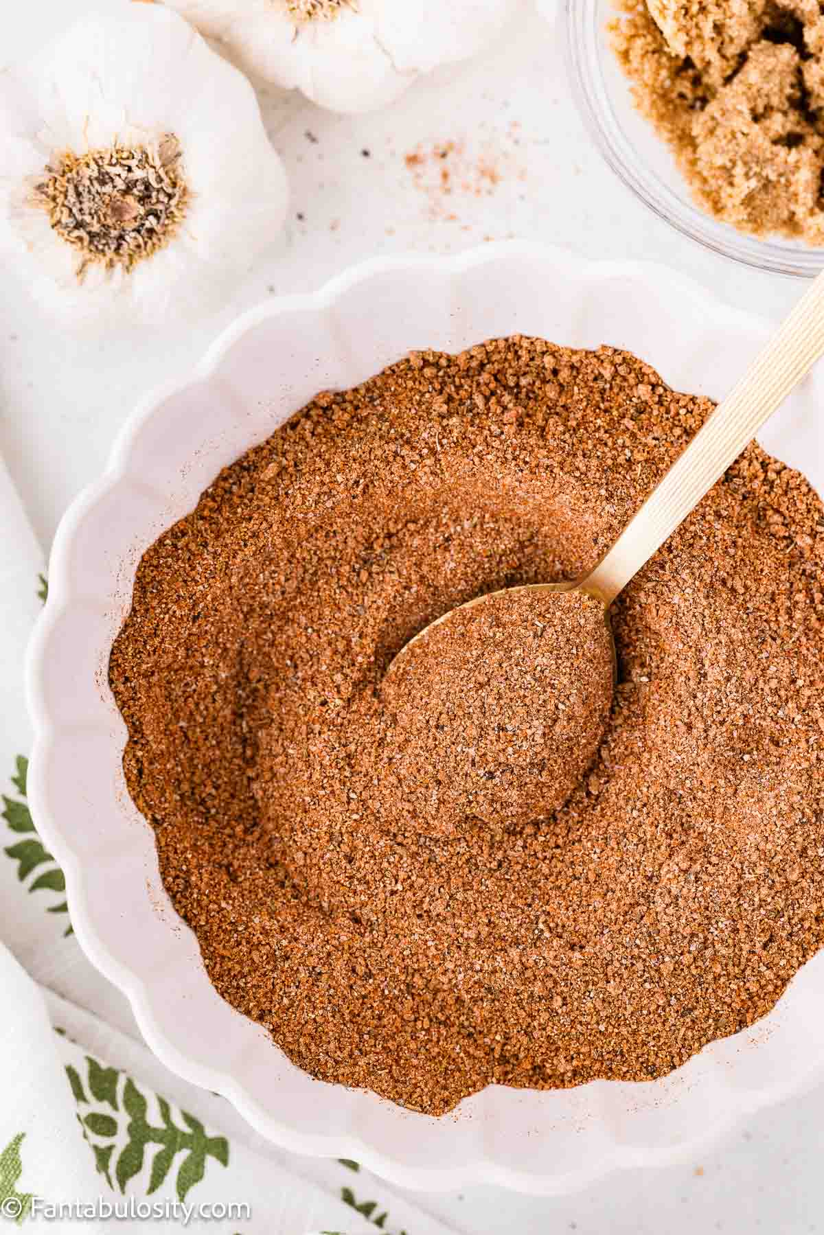 A bowl of homemade dry rub for ribs made with brown sugar and smoked paprika