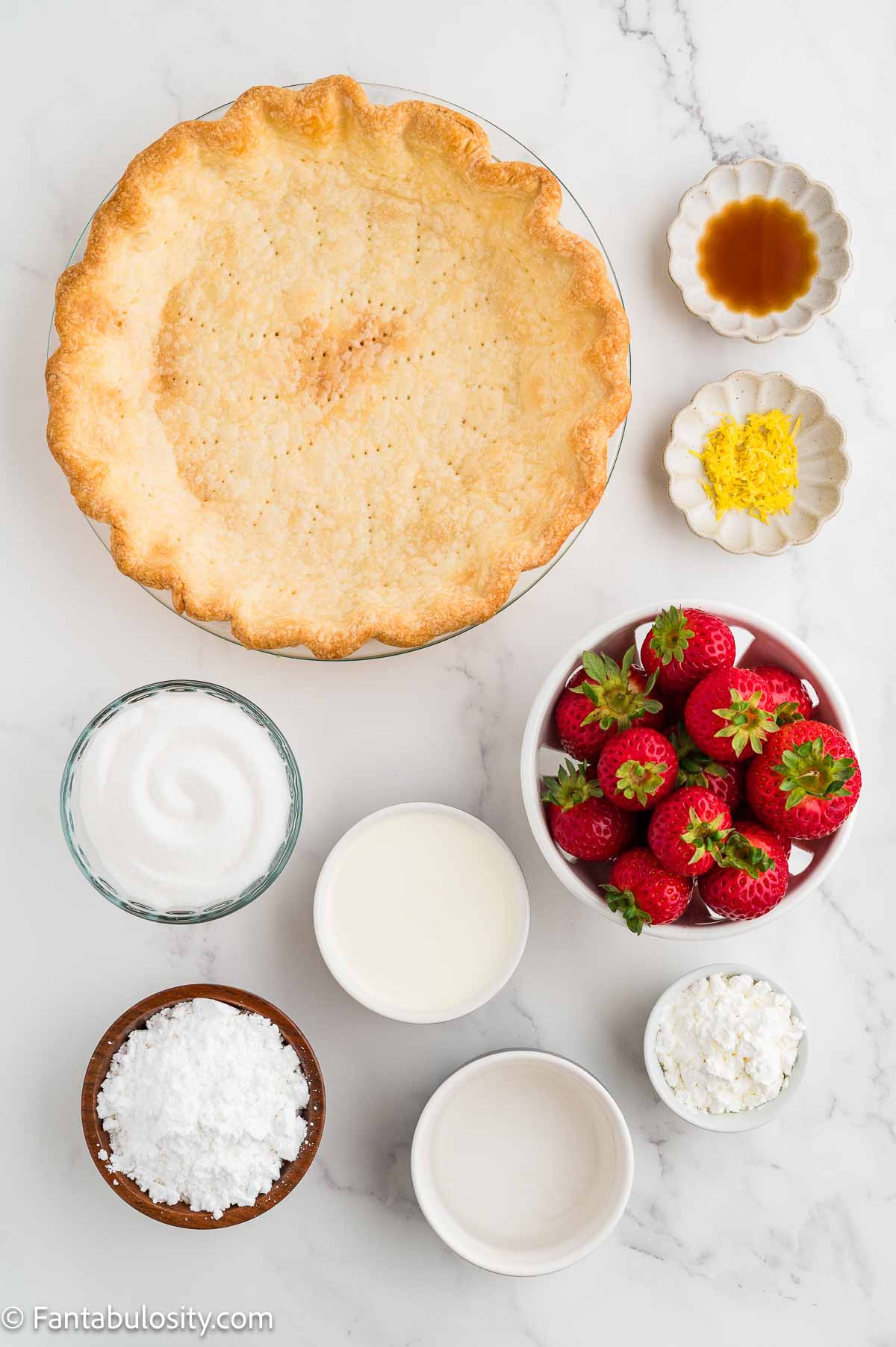 Ingredients for fresh strawberry pie: baked pie crust, strawberries, sugar, cornstarch, water, lemon zest, heavy cream, vanilla, and powdered sugar.