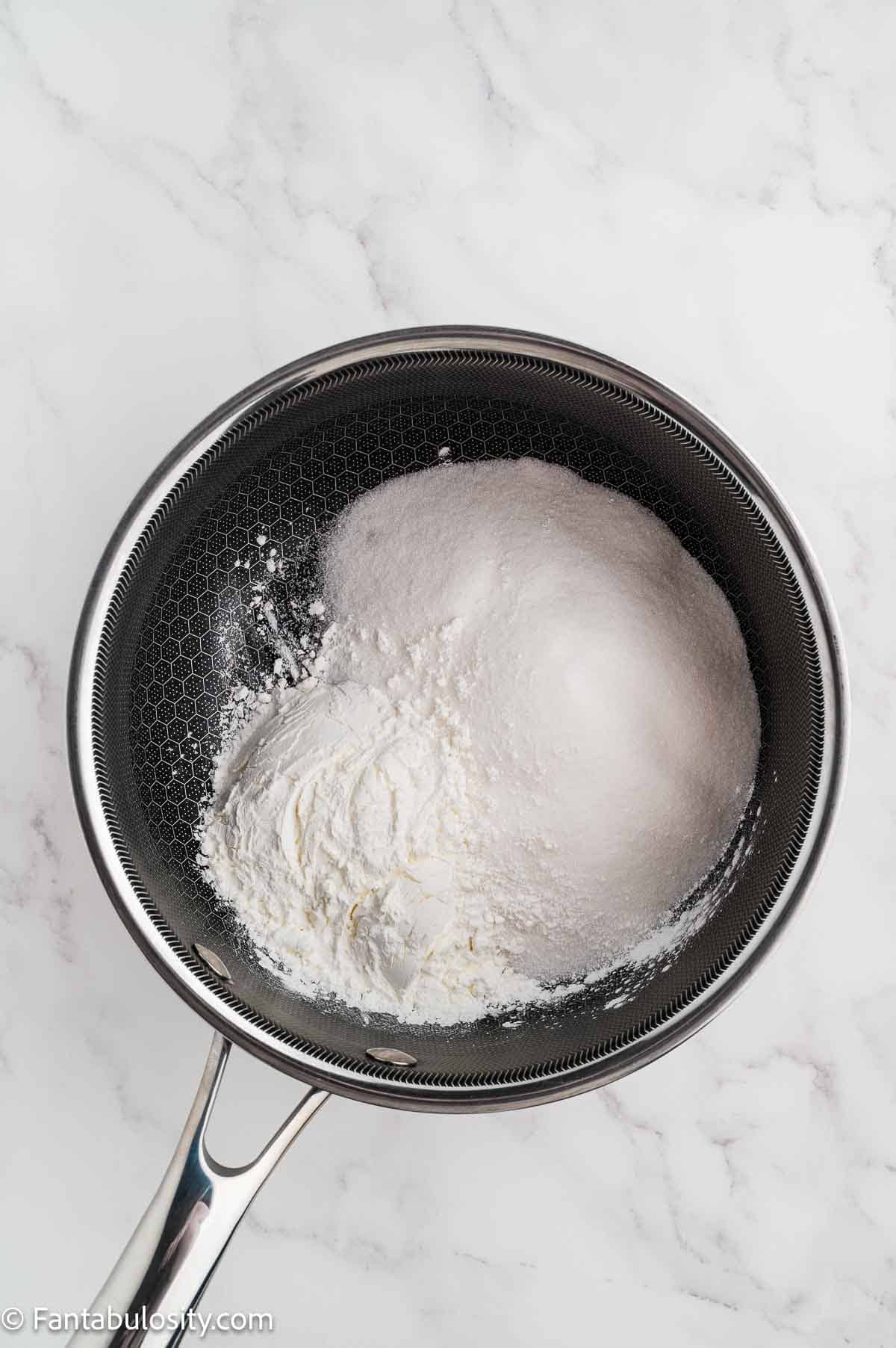 Sugar and cornstarch in a saucepan.