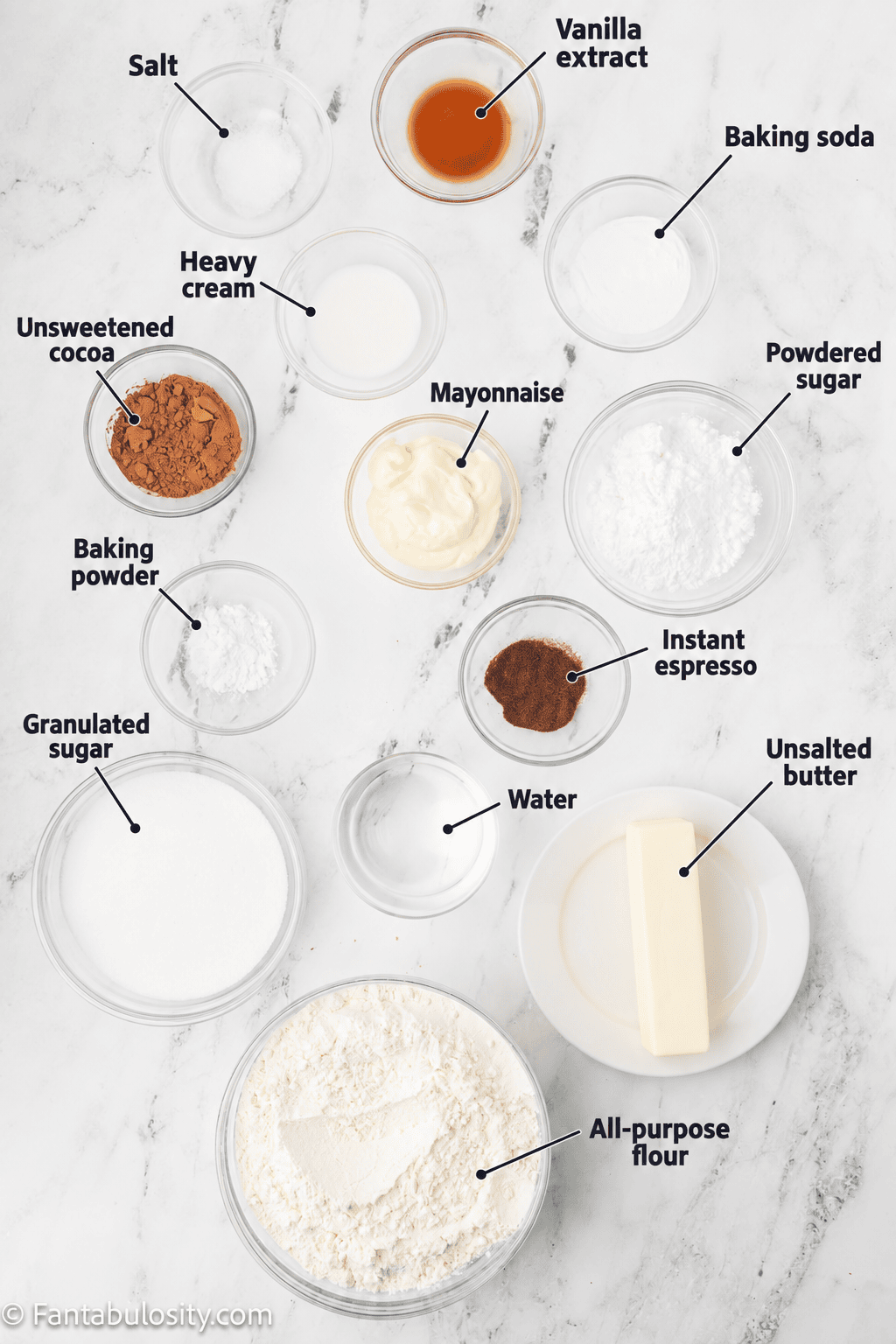 Labeled ingredients for chocolate mayonnaise cake and chocolate frosting, including mayonnaise, flour, two sugars, cocoa, butter, and cream.