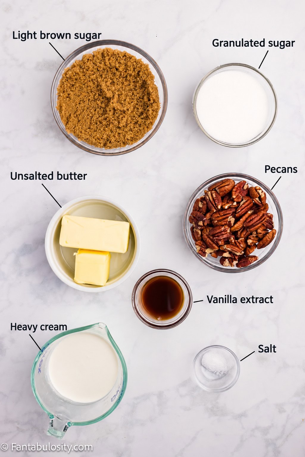 Labeled ingredients for penuche fudge: light brown sugar, granulated sugar, unsalted butter, pecans, vanilla extract, heavy cream and salt.