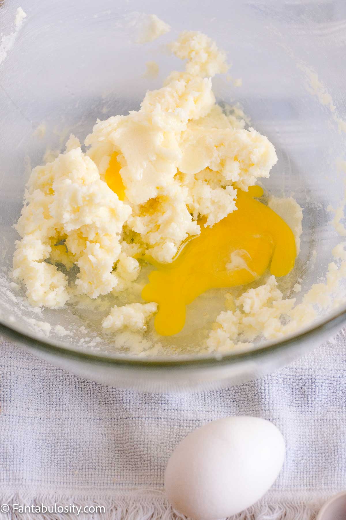 Eggs added to the creamed butter and sugar