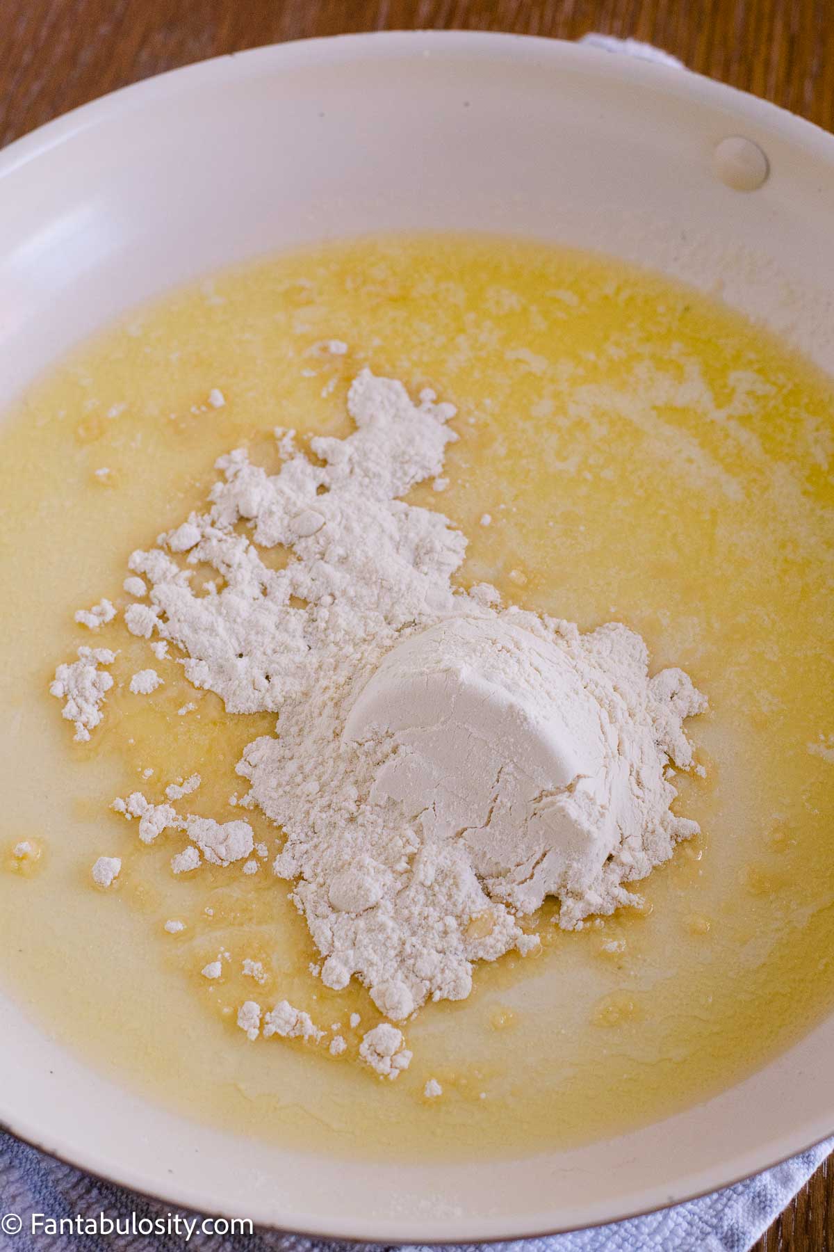Flour added to melted butter to begin the cheese sauce.